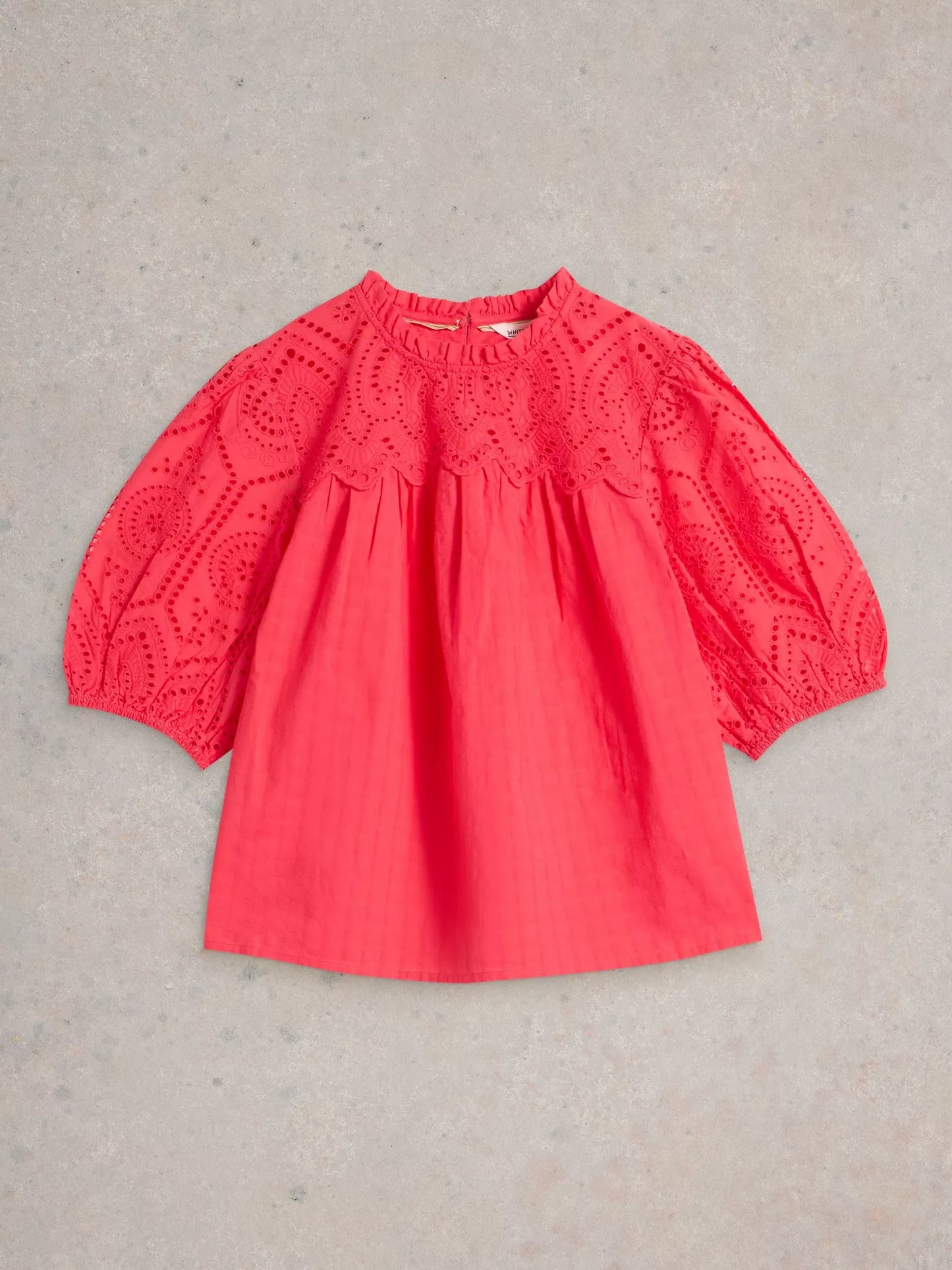 the Lexi Cotton Broderie Top! Featuring delicate broderie lace detailing and a bright coral pink colou