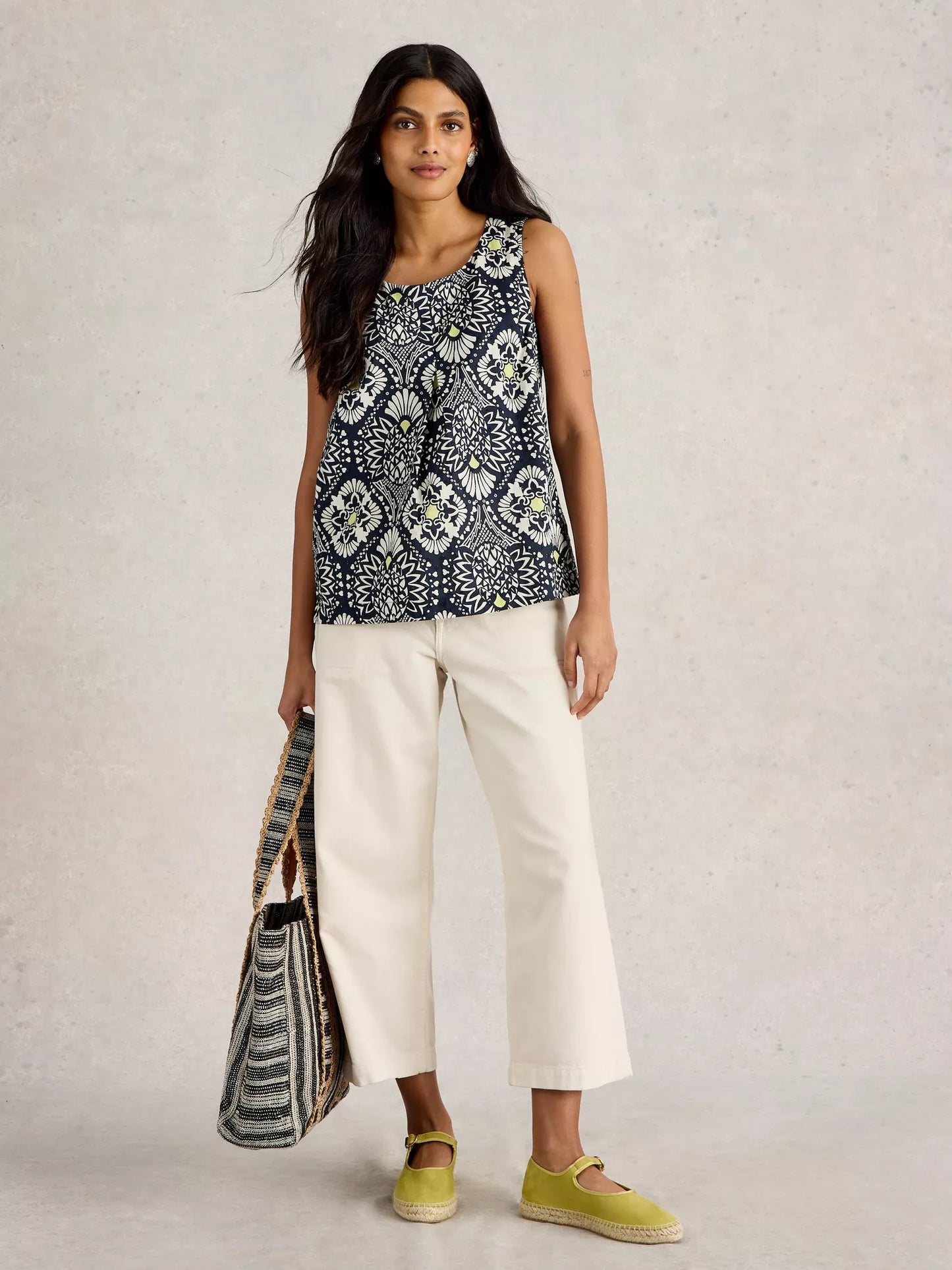 Paradise Cotton Vest, sporting a tropical print with a playful pop of chartreuse along with classic navy and white