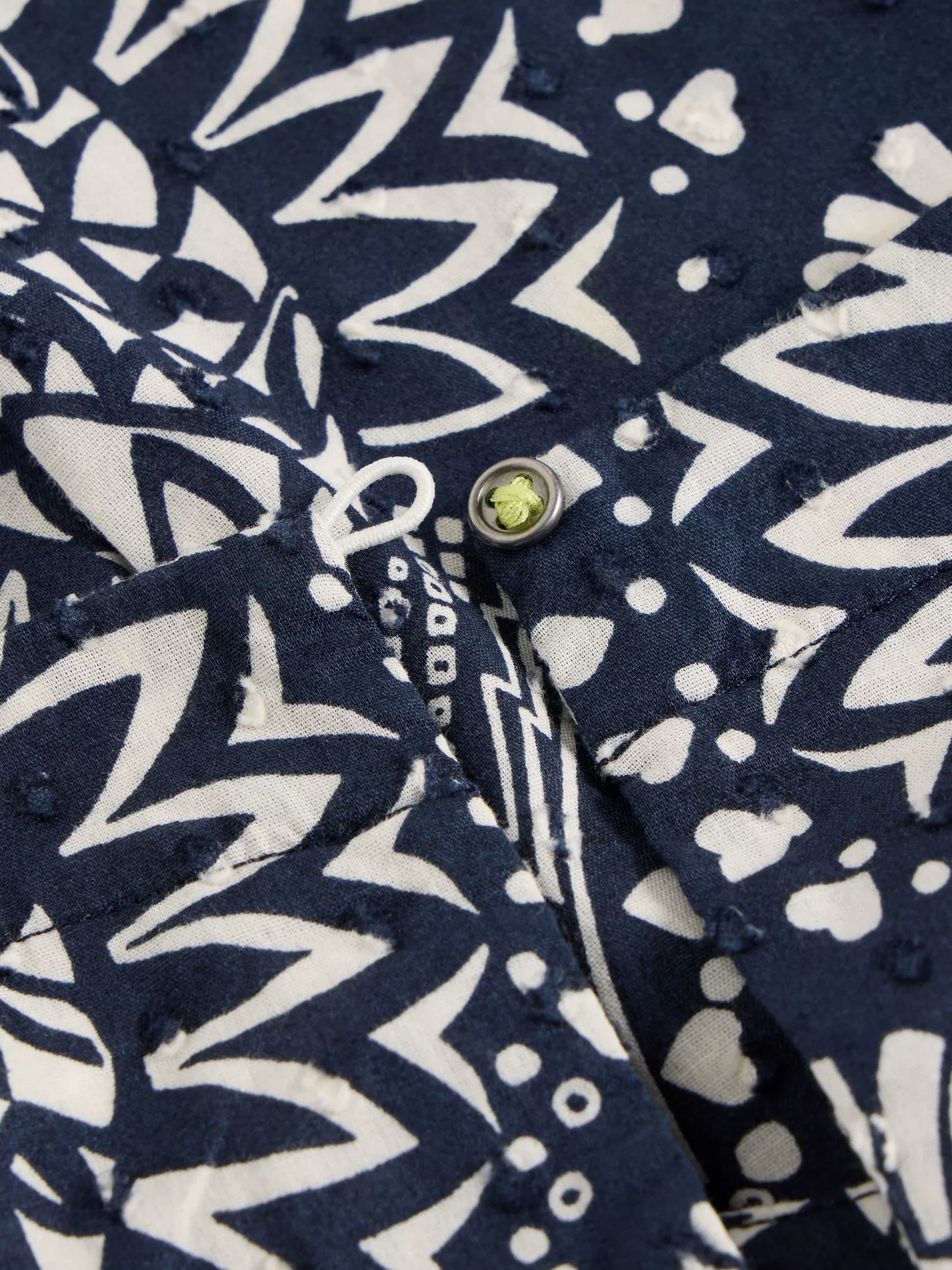 Paradise Cotton Vest, sporting a tropical print with a playful pop of chartreuse along with classic navy and white