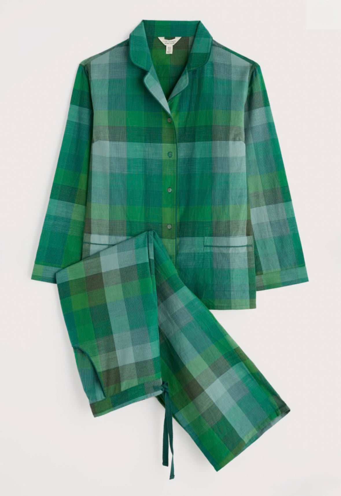 Green plaid pajama set on a white background