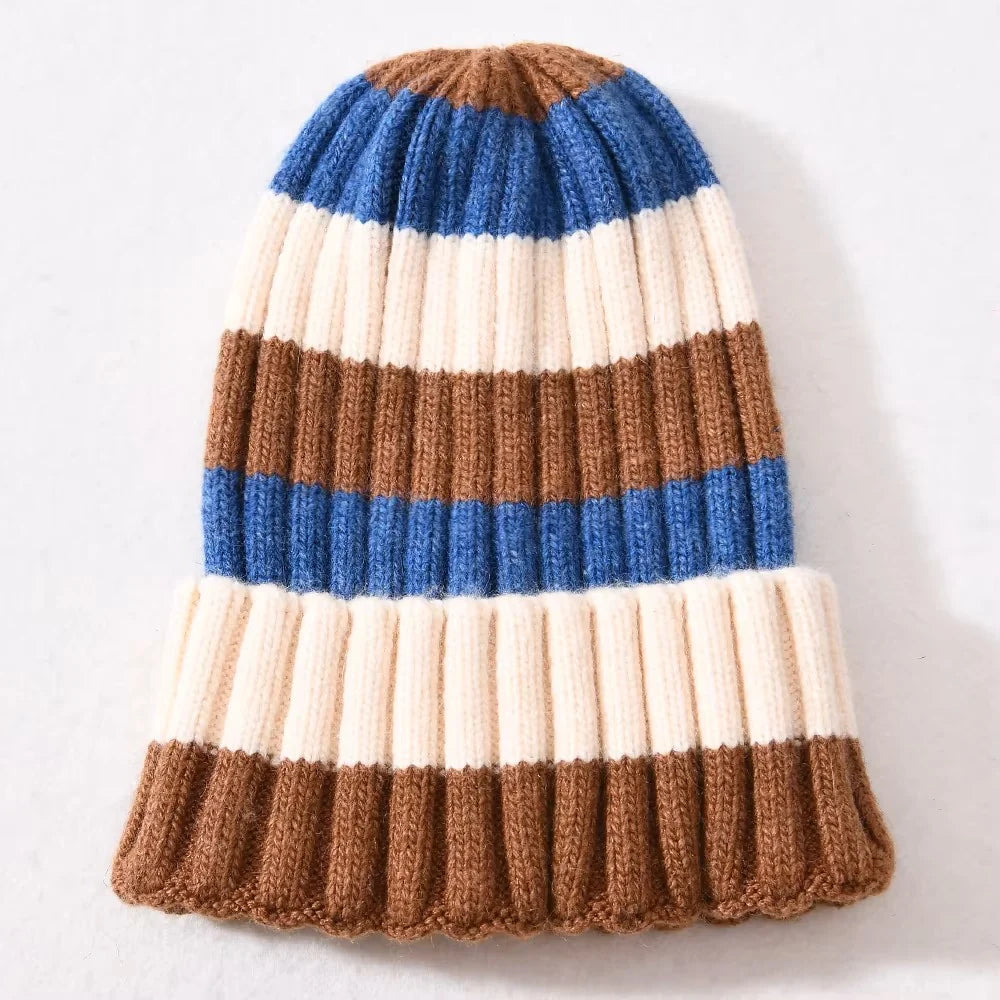 Cognac brown, cream, and blue striped cashmere-blend ribbed beanie with foldover cuff, laid flat on a light background