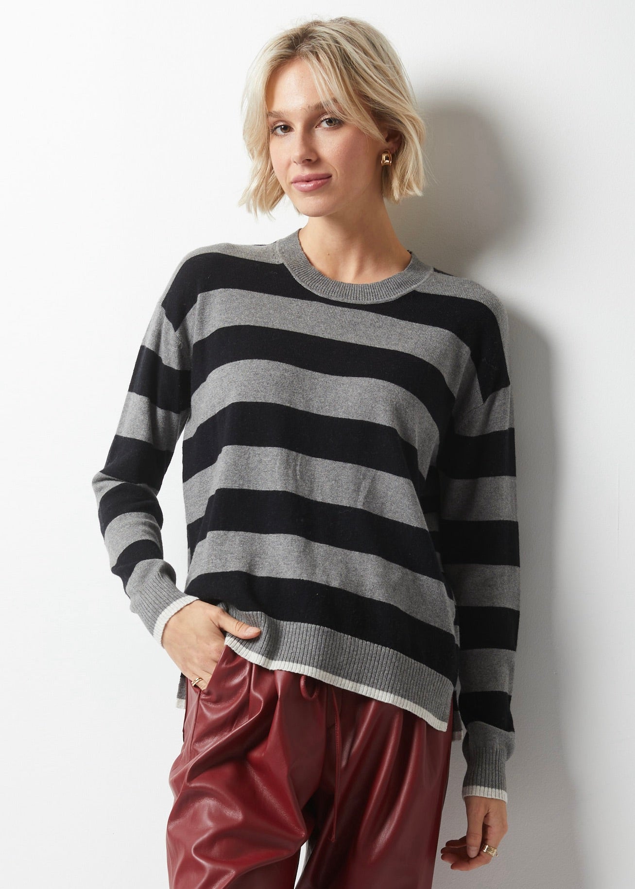 Take your wardrobe to the next level with Essential Striped Crew from Zaket & Plover in Charcoal. This simple sweater is anything but ordinary, featuring stripes of different sizes in black and charcoal on the front and back, along with contrasting accents at the bottom and sleeves in warm white. Made with a luxurious cashmere blend. lemon cyprus boutique