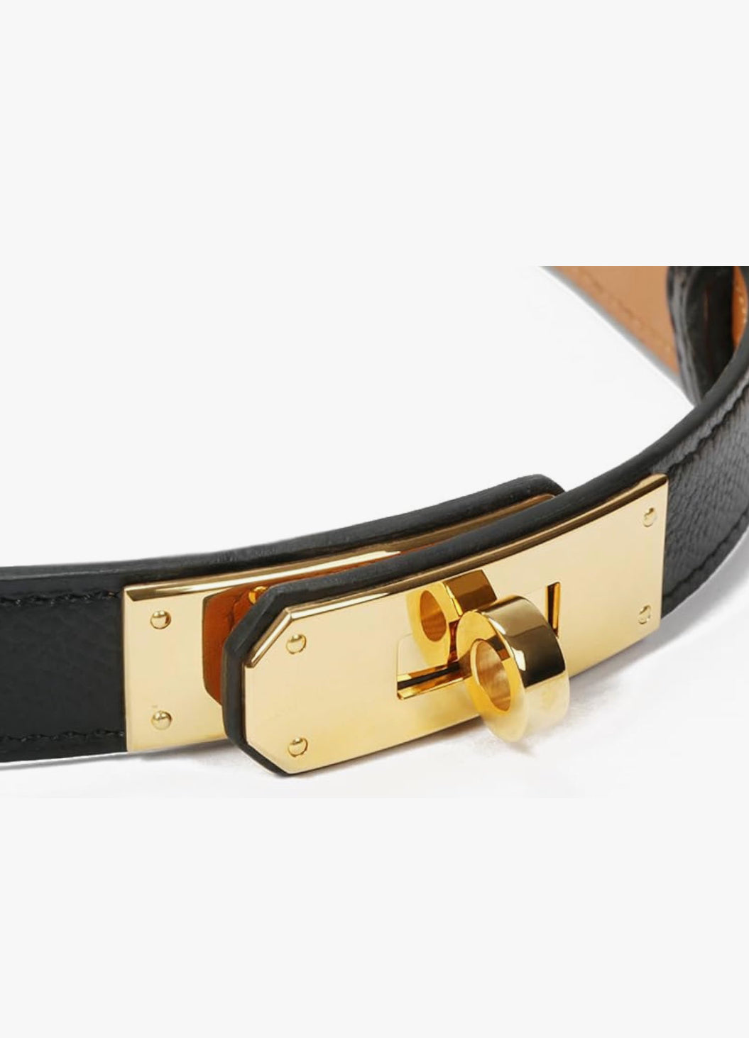 Black belt with a gold buckle on a white background