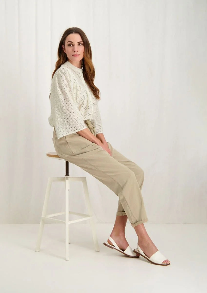 Introducing the Merlin Blouse by Circle of Trust in Antique White. Made from soft 100% cotton eyelet fabric, it's comfy and breathable. With its loose fit and wide 3/4 sleeves, it's effortlessly stylish. Featuring delicate embroidery, a classic crew neck, and a button placket, it's a versatile piece for any occasion. Dress it up or down, it's bound to be one of the prettiest blouses in your wardrobe.