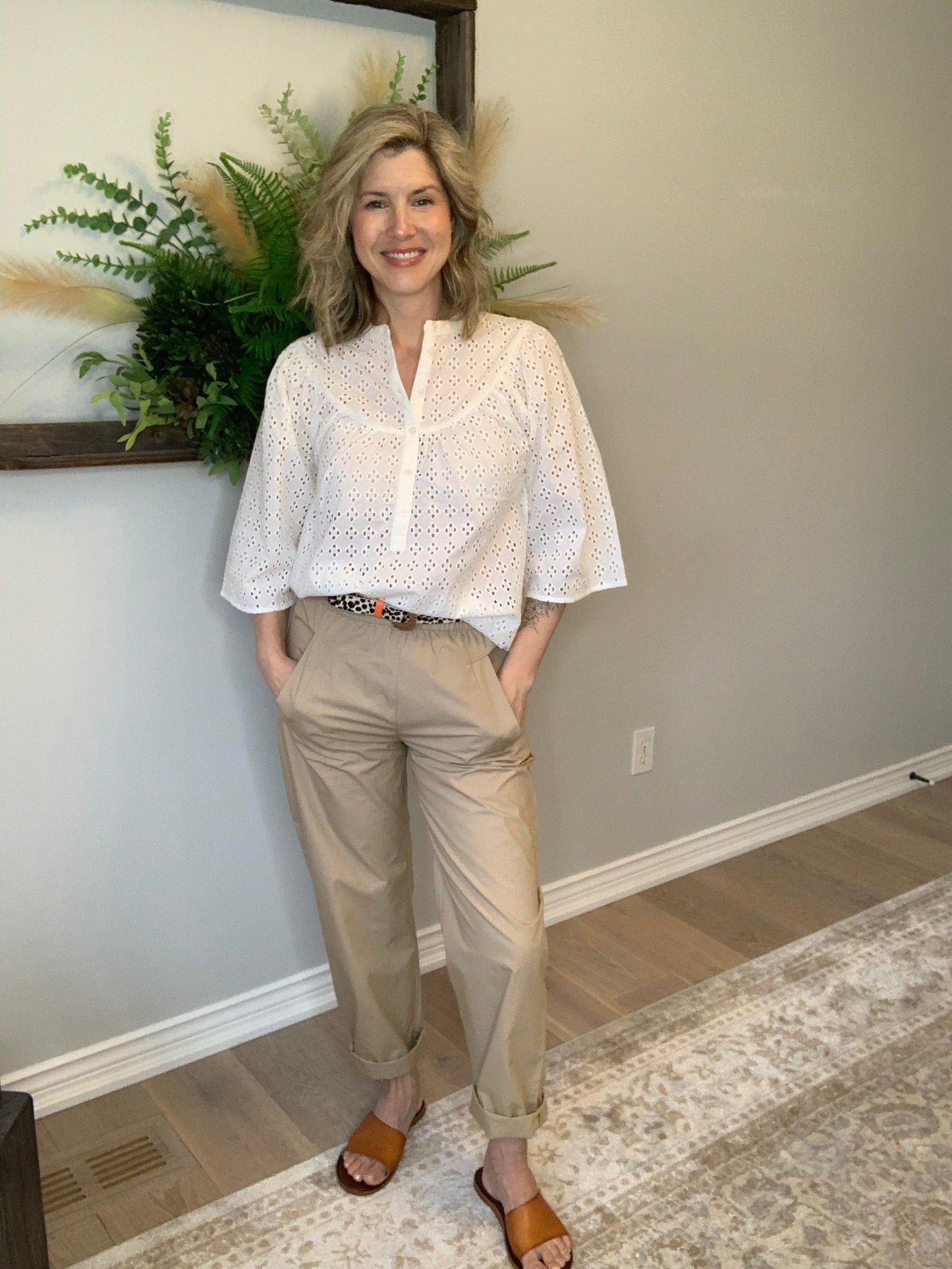 Discover comfort and style with our Millie Cotton Women's Trousers by Circle of Trust, crafted from soft cotton fabric in a chic light coffee hue. These pants feature a flattering straight fit and are equipped with a convenient elastic waistband for ease of wear. Complete with practical side pockets, they are perfect for effortless everyday elegance. Roll them up for a more casual look.