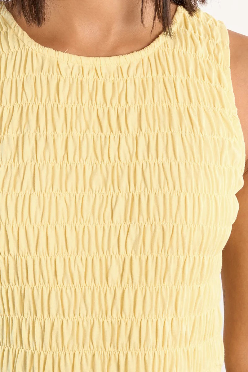 Close-up of a yellow textured sleeveless top