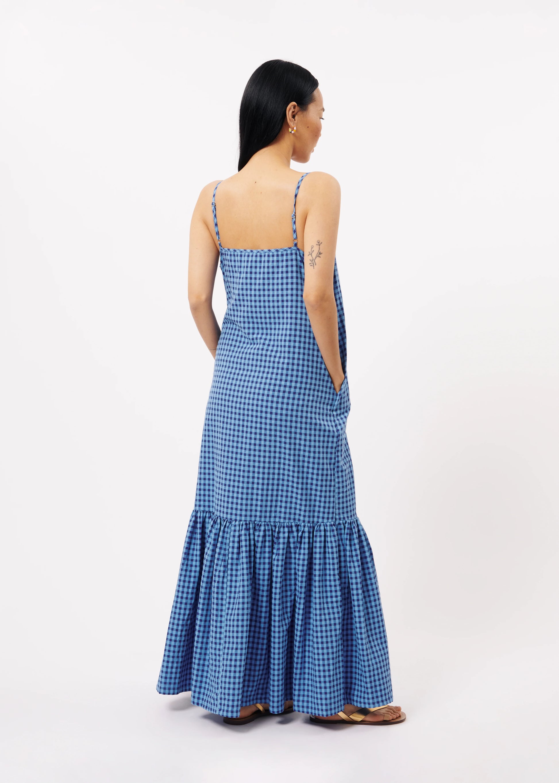 The FRNCH Neha Dress features a stylish Vichy gingham pattern in two tone blue and a straight, form-flattering cut, pockets and thin straps. Perfect for an effortless and chic look while out and about in town, day or night.