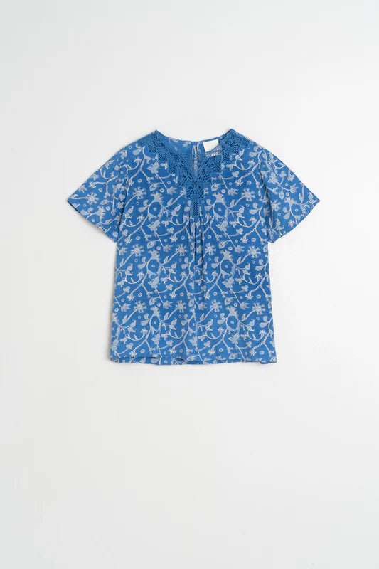 Blue floral blouse on a white background