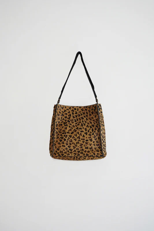 Leopard print handbag on a white background