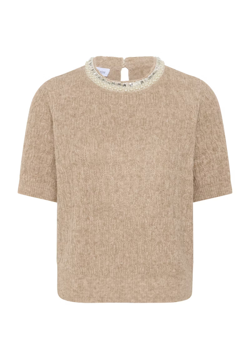 Beige sweater with lace trim on a white background