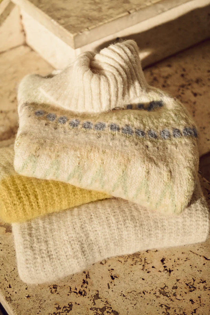 Pair of socks with text on a textured surface