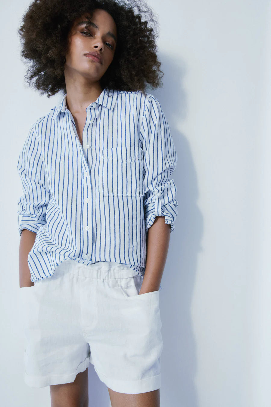 Elevate your summer style with the Garence Paper Bag Style Shorts by Melissa Nepton. Crafted from crisp white linen, these shorts offer a fresh and sophisticated look for any occasion. Featuring a trendy paper bag waist design, these shorts are both fashionable and comfortable. Pair them with a breezy blouse for a casual day out or dress them up with a chic top for an evening ensemble. Add a touch of effortless elegance to your wardrobe with the Garence Paper Bag Style Shorts.