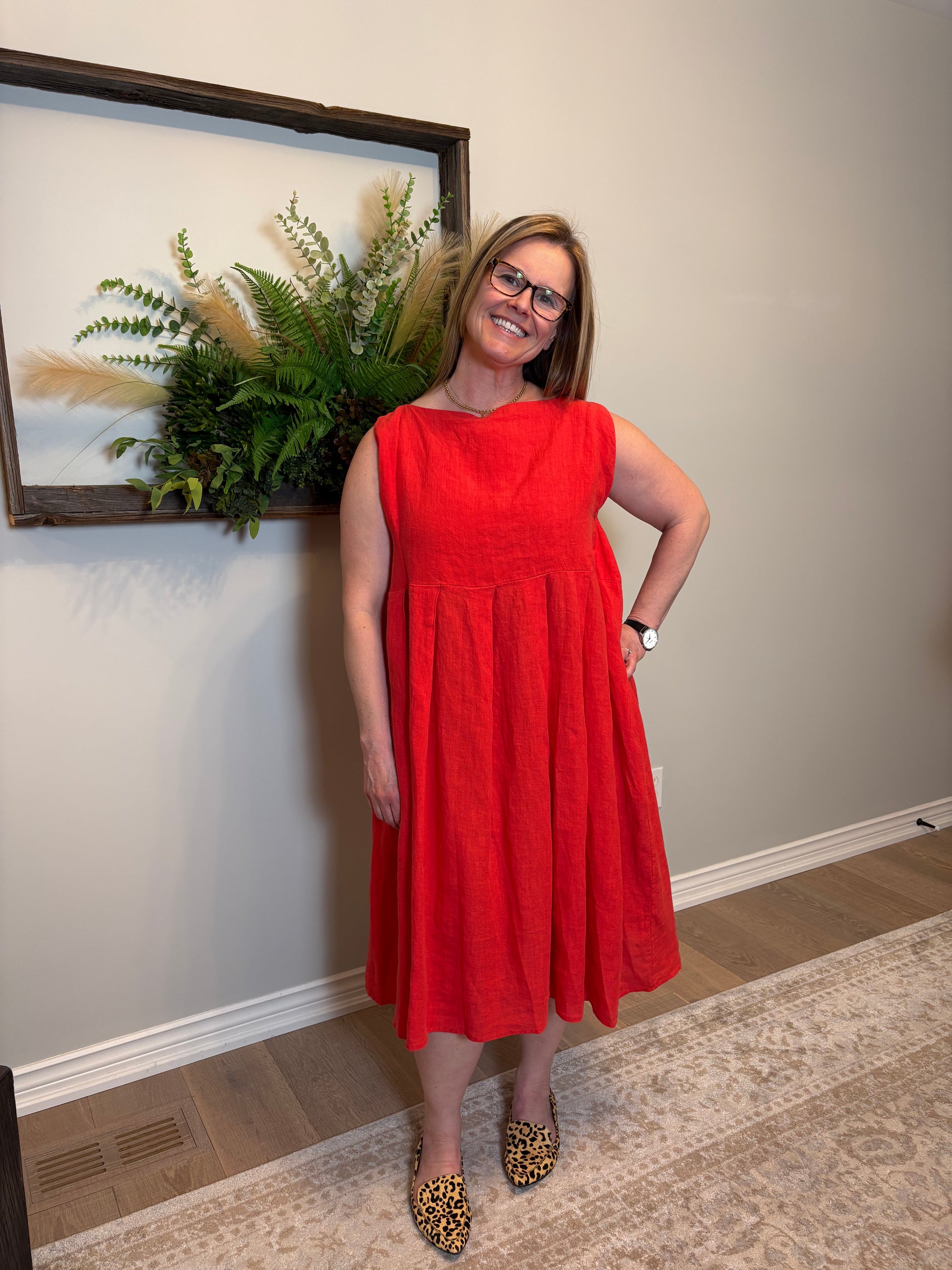 This poppy red Lully Dress by Naif is a standout piece that’s equal parts bold and breezy. Made from 100% linen, it’s lightweight and breathable—perfect for warm days. The sleeveless cut and empire waist give it a relaxed babydoll shape that feels easy and flattering, while the loose A-line fit adds to the laid-back vibe. Buttons down the back add a sweet, unexpected detail