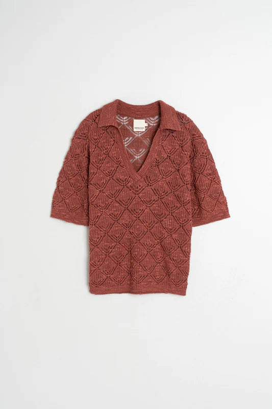 Red knitted cardigan on a white background