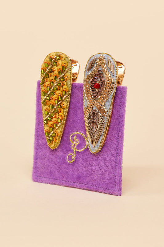 Groovy and glam! This is where exceptional design meets 60s dreaming. These feather and stripe hair clips by Powder UK are the perfect gift for any free spirit in your life. Elevate styling from day to night effortlessly with these exquisite handmade hairclips. Made in India, they come on a velvet card for the most thoughtful gift for someone or treat for yourself.