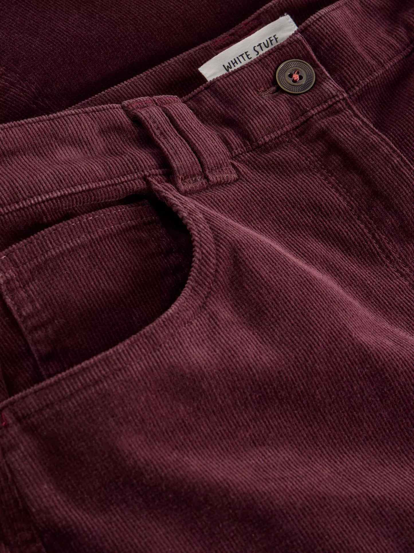 Revamp your wardrobe with The Quinn, a knee-high burgundy cord skirt from White Stuff. Its high waist and midi length make it the perfect addition to any outfit.