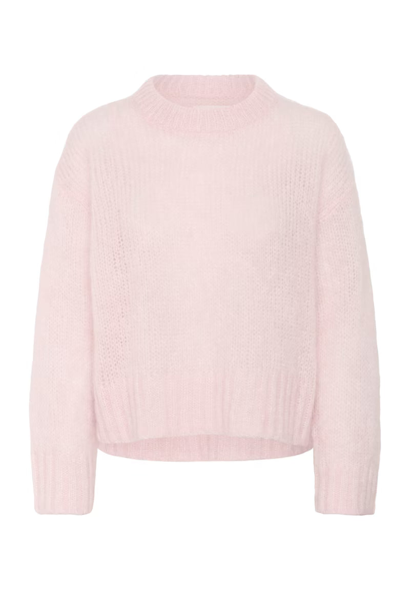 Light pink sweater on a white background