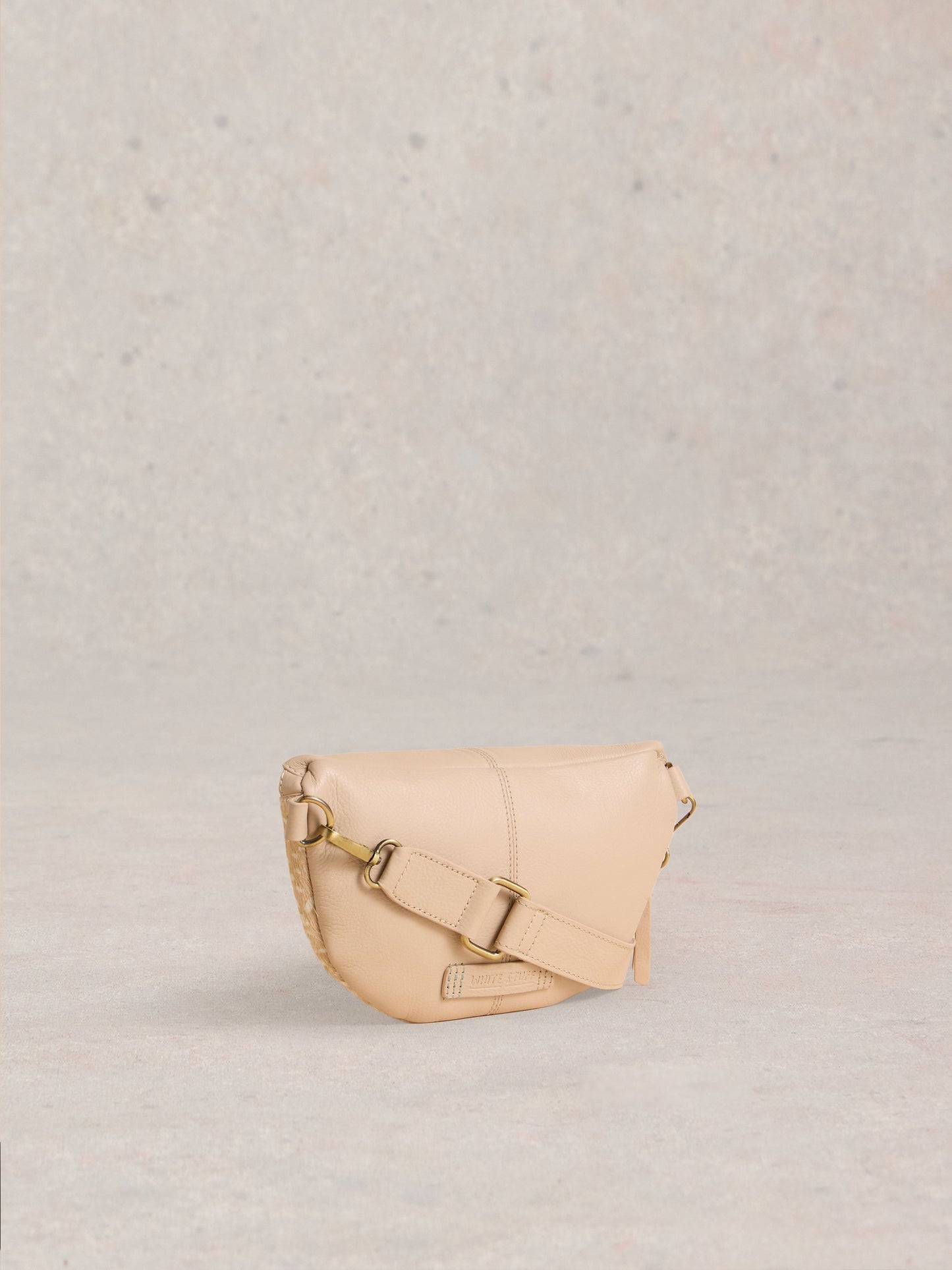 Beige handbag on a light gray background
