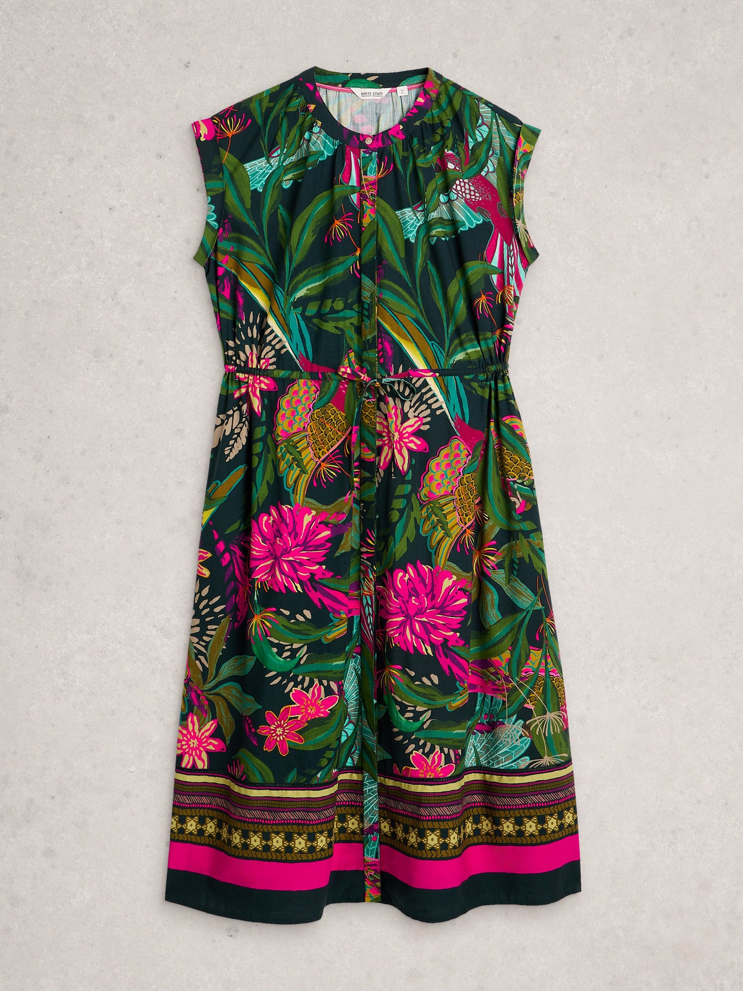 Colorful floral dress with a pattern of pink flowers and green leaves on a light gray background