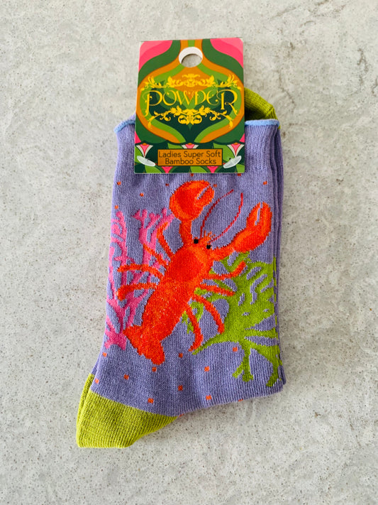 Featuring bamboo, Powder UK's luxurious ankle socks are the perfect complement to any pair of shoes. With playful purple and green designs, these bright orange lobsters are a unique and playful addition to your ankle.