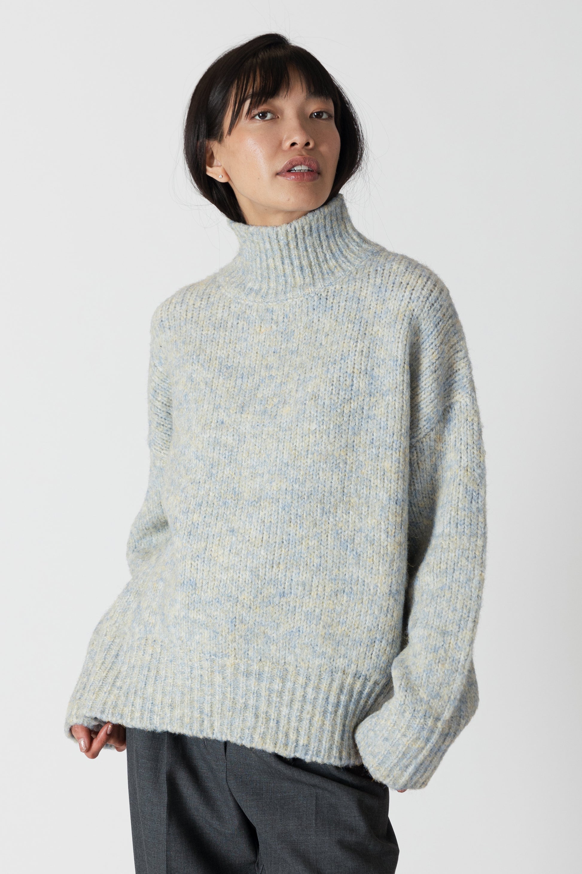 Our Aggie sweater, in a stunning blue yellow marl, brings both style and warmth to your wardrobe. With its flattering fit and luxurious fabric, this mock neck sweater from Lyla &amp; Luxe is perfect for any occasion. lemon cyprus boutique