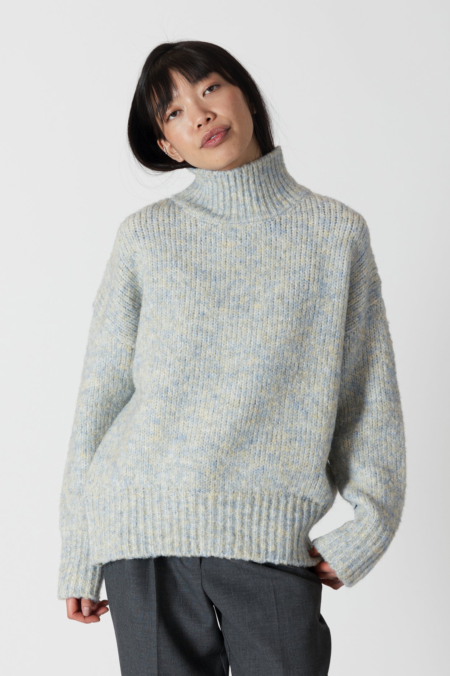 Our Aggie sweater, in a stunning blue yellow marl, brings both style and warmth to your wardrobe. With its flattering fit and luxurious fabric, this mock neck sweater from Lyla &amp; Luxe is perfect for any occasion. lemon cyprus boutique