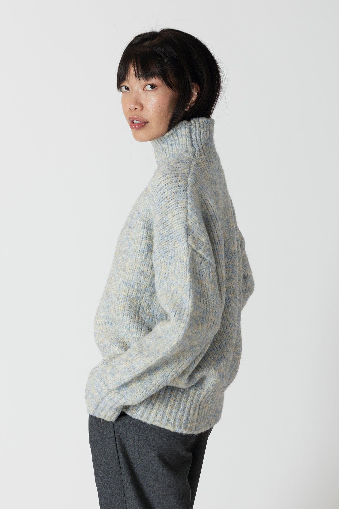 Our Aggie sweater, in a stunning blue yellow marl, brings both style and warmth to your wardrobe. With its flattering fit and luxurious fabric, this mock neck sweater from Lyla &amp; Luxe is perfect for any occasion. lemon cyprus boutique