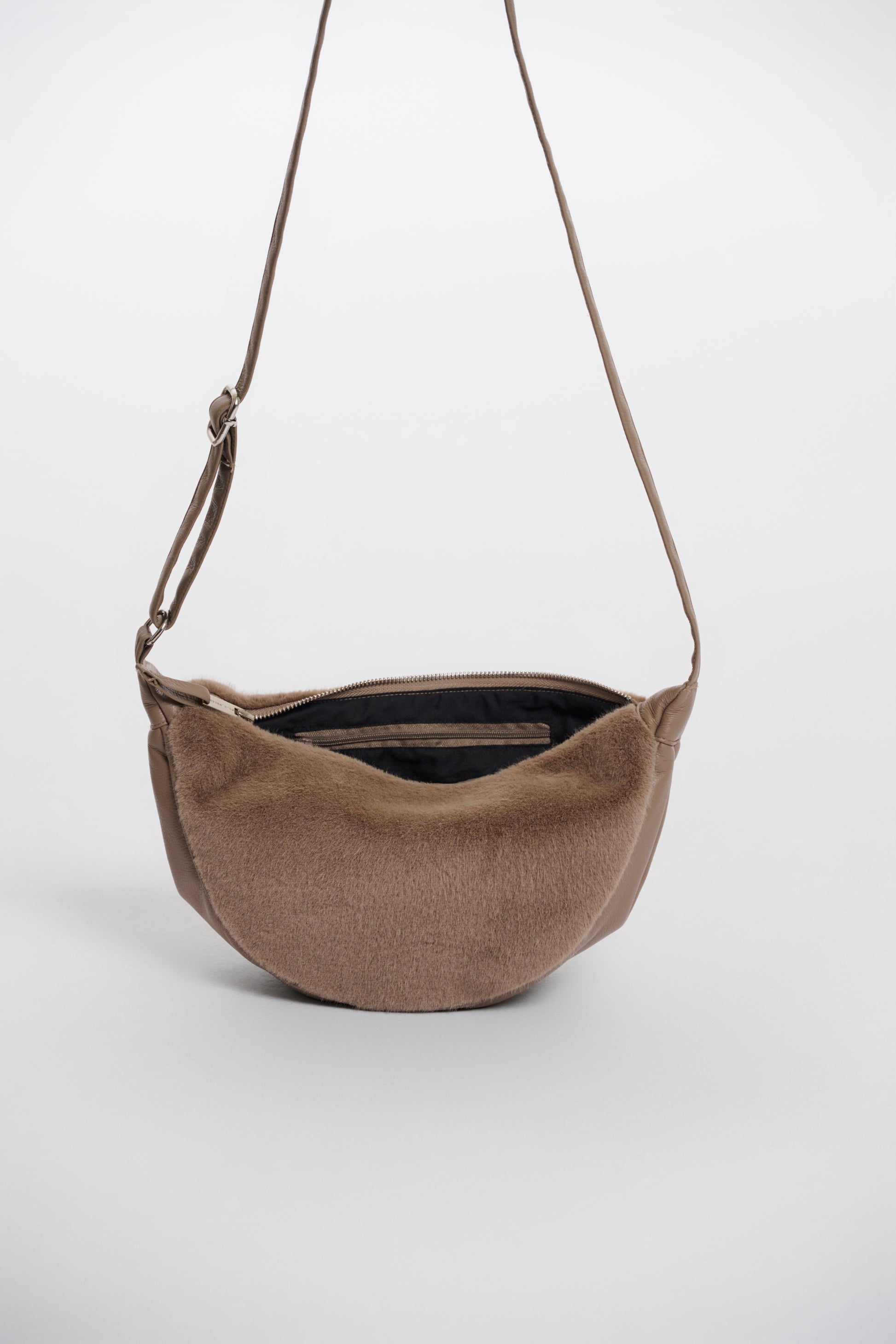 Brown fabric bag with a strap on a white background