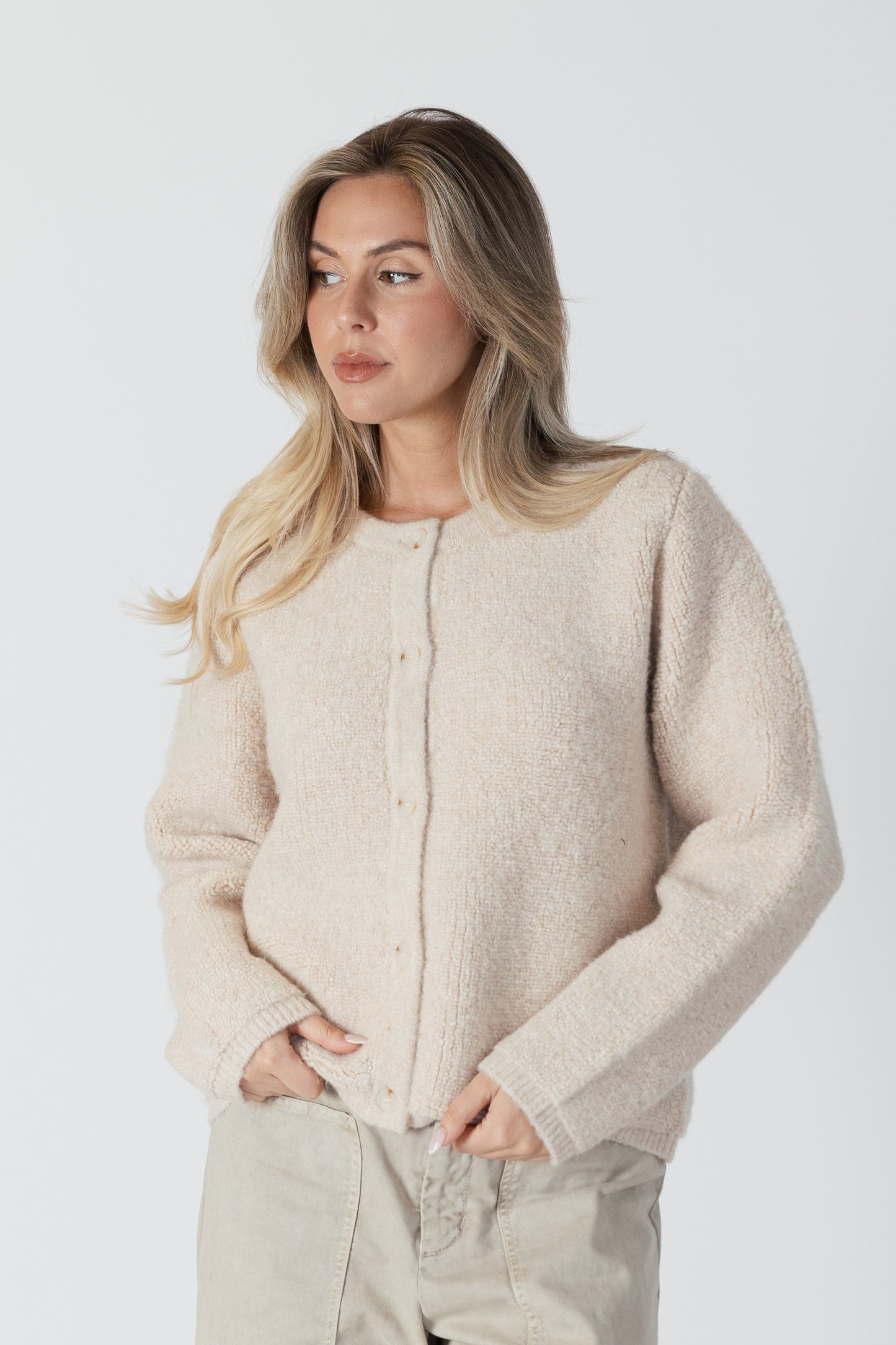 The Ellie Luxe Sherpa Cardi from Lyla &amp; Luxe is a beautiful vanilla-coloured button-up cardigan that exudes coziness. Perfect for wearing as a fall jacket or a comfy layering piece, this cardi will have you feeling like you're wrapped in a warm, fluffy vanilla cloud. lemon cyprus boutique