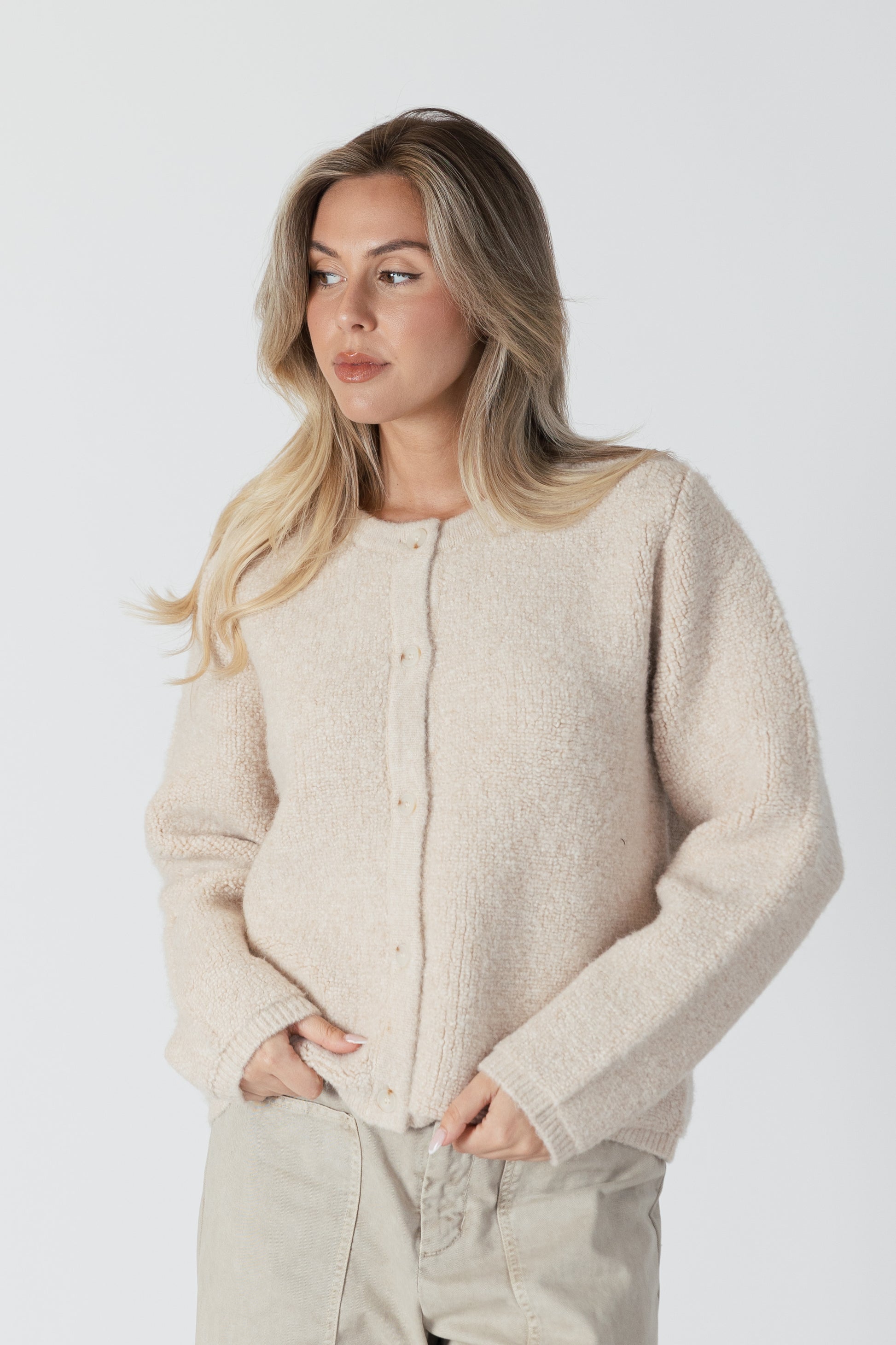 The Ellie Luxe Sherpa Cardi from Lyla &amp; Luxe is a beautiful vanilla-coloured button-up cardigan that exudes coziness. Perfect for wearing as a fall jacket or a comfy layering piece, this cardi will have you feeling like you're wrapped in a warm, fluffy vanilla cloud. lemon cyprus boutique