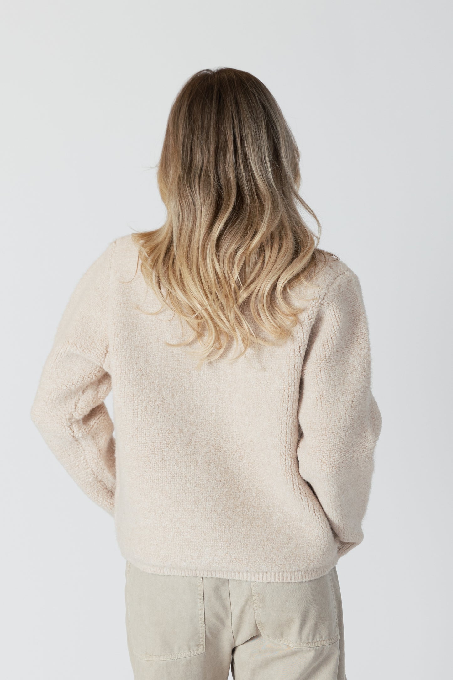 The Ellie Luxe Sherpa Cardi from Lyla &amp; Luxe is a beautiful vanilla-coloured button-up cardigan that exudes coziness. Perfect for wearing as a fall jacket or a comfy layering piece, this cardi will have you feeling like you're wrapped in a warm, fluffy vanilla cloud. lemon cyprus boutique