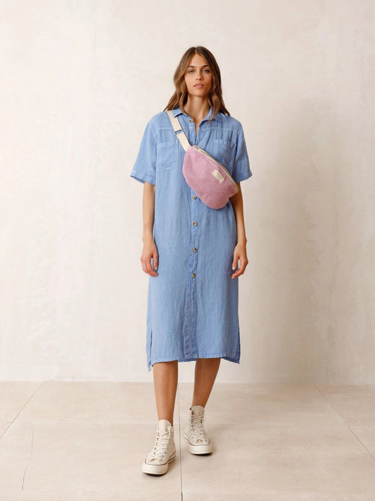 Experience the ultimate in comfort and style with Indi &amp; Cold's 100% linen dress/shirt in blue. Featuring side slits and a button closure, this versatile garment can be worn as a dress or a long shirt jacket, suitable for any occasion. Its feminine design and luxurious fabric make it a staple for everyday wear.