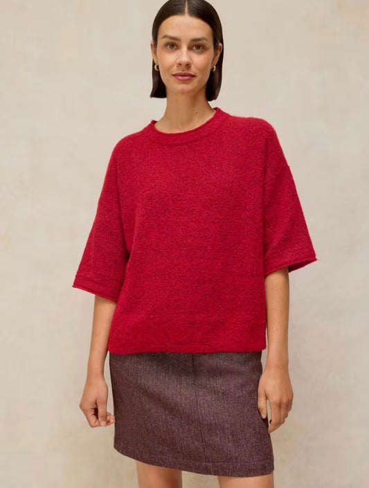 Woman wearing the red Kate knitted tee by White Stuff
