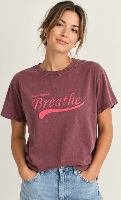 a plum vintage-wash graphic tee with “Always Remember Breathe” script print