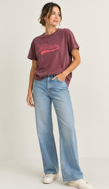 a plum vintage-wash graphic tee with “Always Remember Breathe” script print