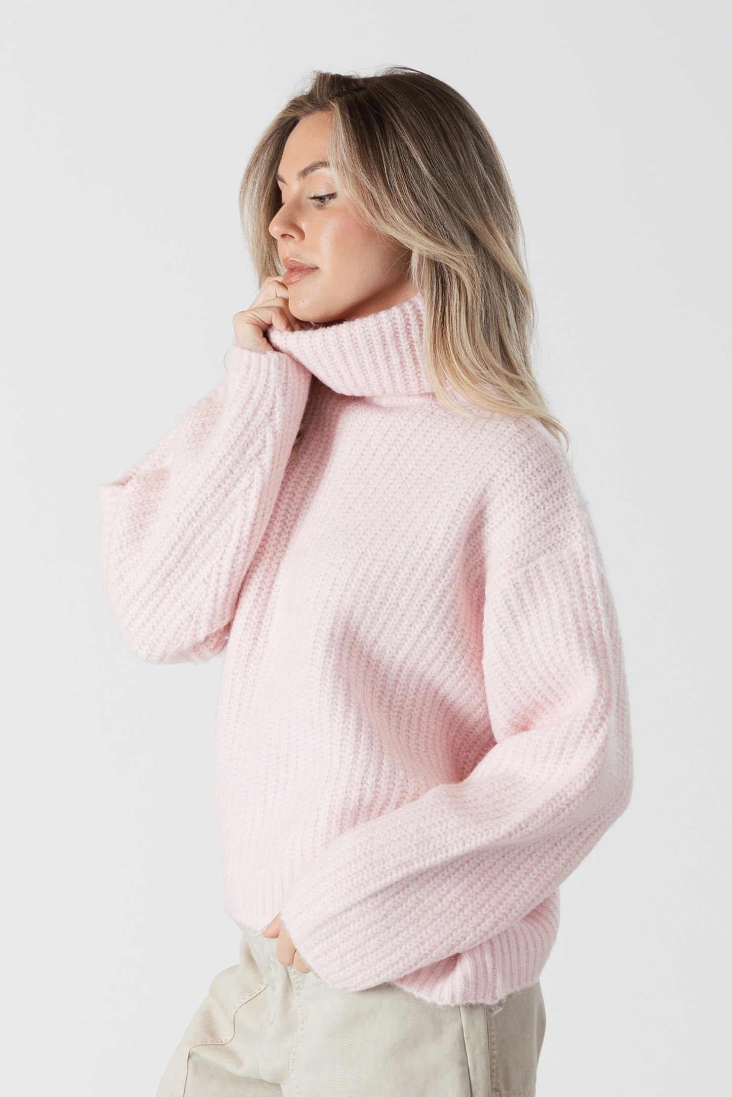 The Lyla &amp; Luxe Sahar sweater in a gentle pink hue is designed to flatter. Its marled texture adds depth and a bit of stretch for ultimate comfort. The mockneck adds a hint of elegance and warmth, ideal for cooler weather.  lemon cyprus boutique