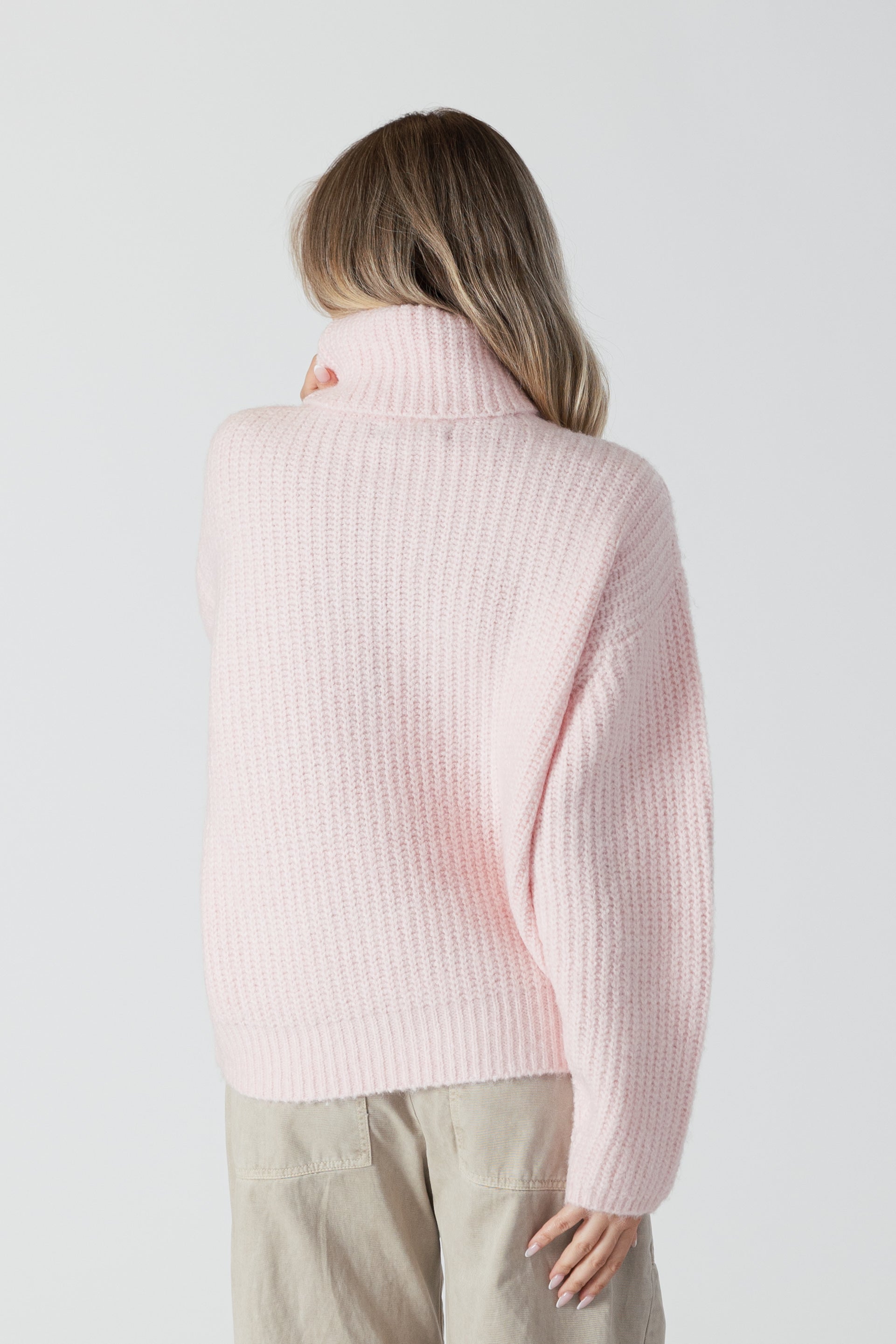 The Lyla &amp; Luxe Sahar sweater in a gentle pink hue is designed to flatter. Its marled texture adds depth and a bit of stretch for ultimate comfort. The mockneck adds a hint of elegance and warmth, ideal for cooler weather.  lemon cyprus boutique