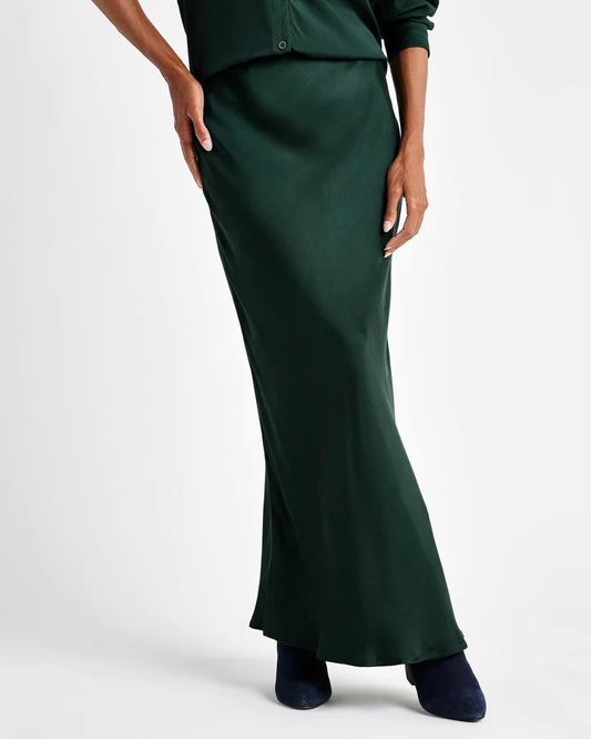 Relaxed glamour-- that's how we describe our Orla Satin Skirt by Splendid in this rich teal colour. This elevated maxi is crafted from sleek cupro satin in a bias cut slip-style design. It hits at the natural waistline with a side zip and a floor-length hem with a side vent. Top it with sweaters, button-downs or tanks-- it lends a polished finish to anything you pair it with.