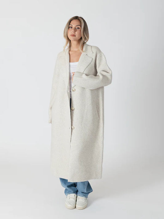 Elegant and timeless, the Victoria Luxe coat by Lyla &amp; Luxe is designed to effortlessly elevate any outfit. Combining comfort and style, it features a classic notch collar, pockets, and a cozy fit. Perfect for chilly mornings or a night out, this coat is an outerwear must-have. lemon cyprus boutique