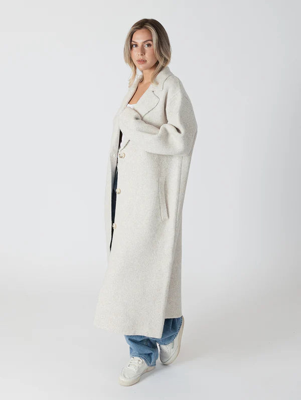 Elegant and timeless, the Victoria Luxe coat by Lyla &amp; Luxe is designed to effortlessly elevate any outfit. Combining comfort and style, it features a classic notch collar, pockets, and a cozy fit. Perfect for chilly mornings or a night out, this coat is an outerwear must-have. lemon cyprus boutique