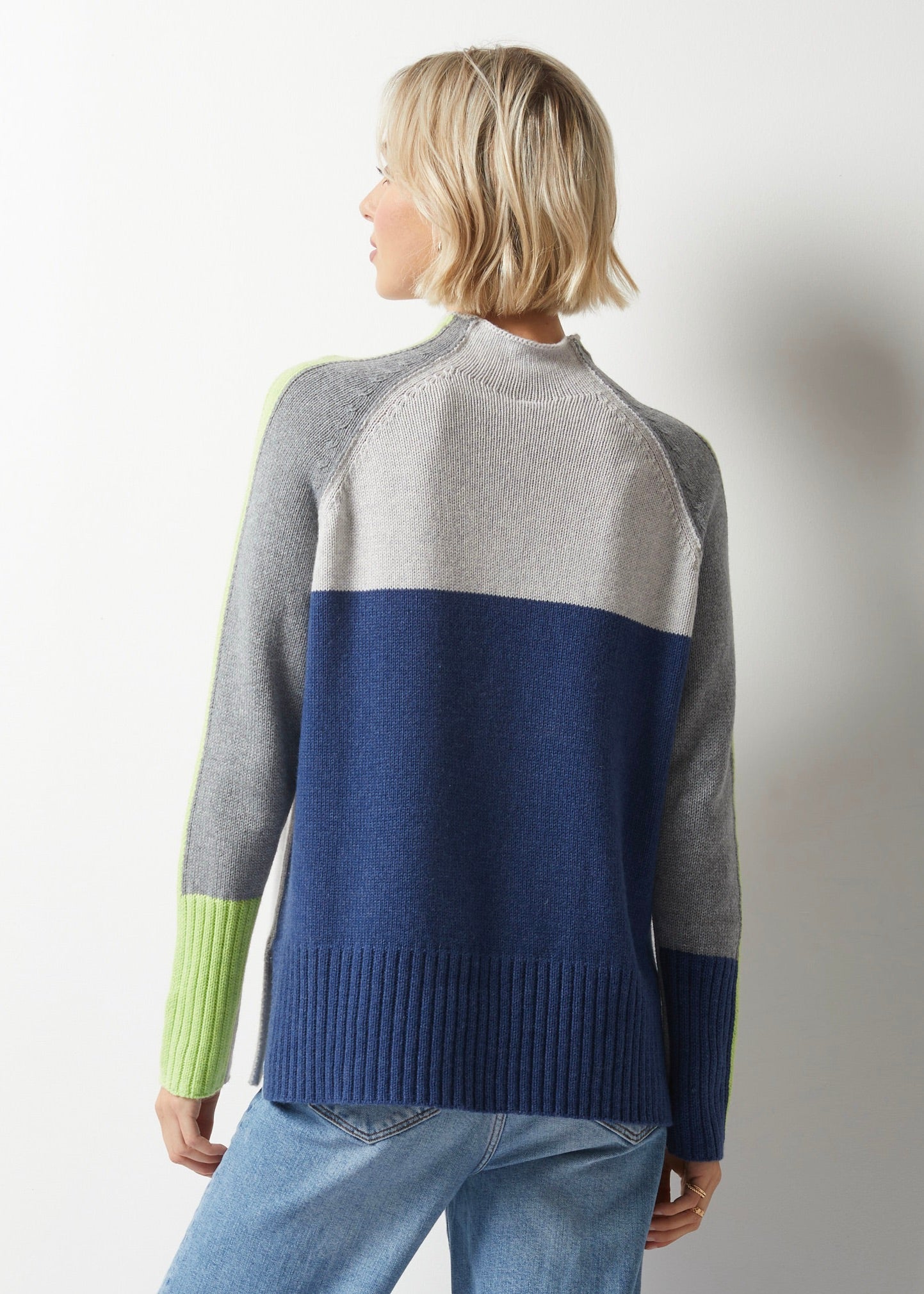 Embrace style and comfort in Zaket &amp; Plover's Intarsia Funnel Neck Sweater. The eye-catching colour block pattern with a pop of neon yellow will make a statement, while the cozy material keeps you warm and snug (and stylish) all day long!