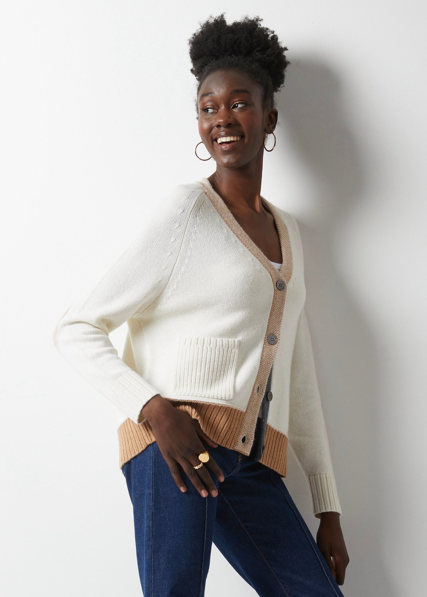 Get ready to fall in love with fashion all over again, thanks to this White Elbow Patch Cardi by Zaket &amp; Plover. Cozy up in a luxurious cashmere cotton blend with soft white details and a touch of camel and charcoal grey to add a pop of color. The camel elbow patches are the perfect playful touch, giving it that little something extra. lemon cyprus boutique