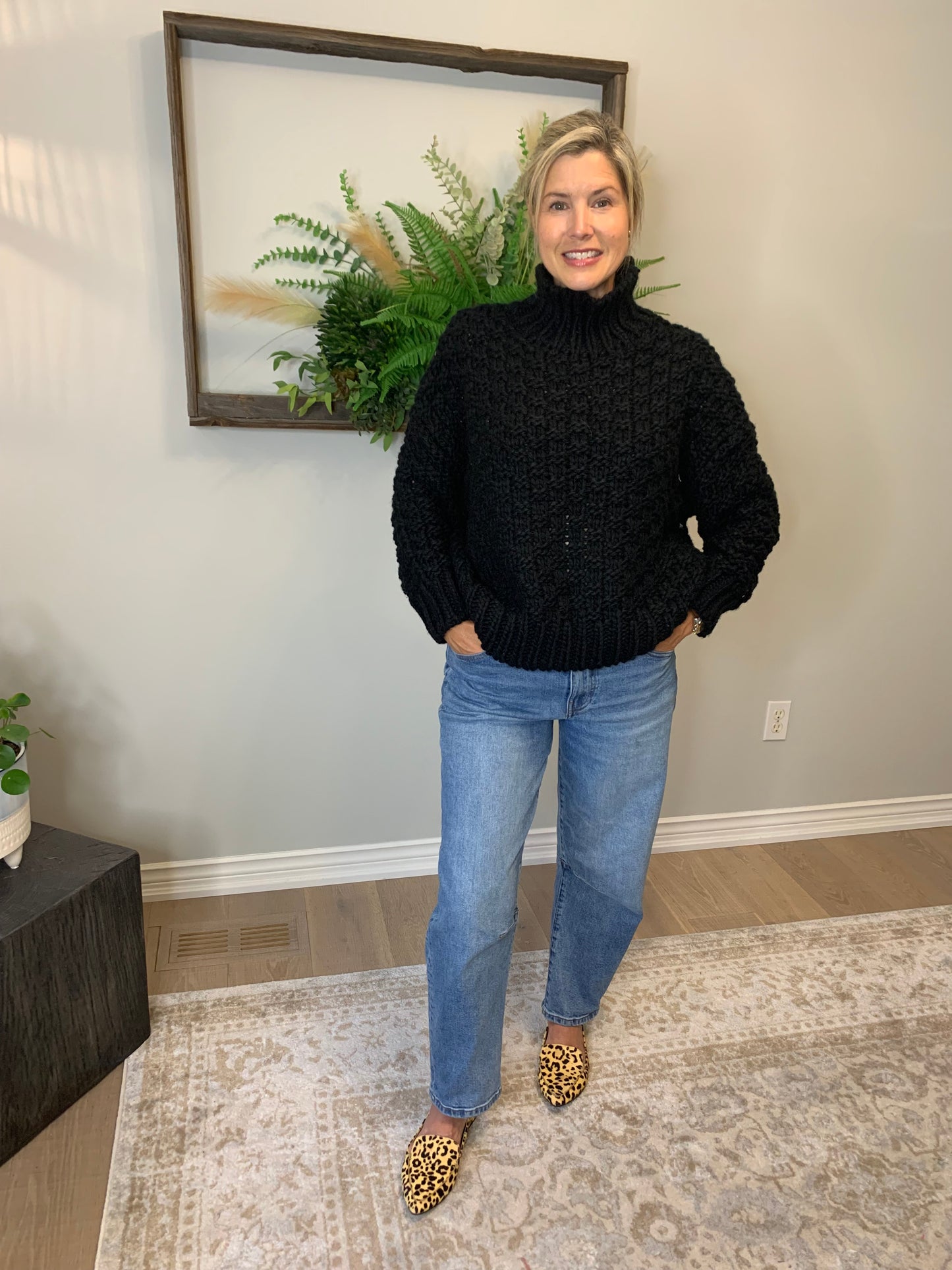 Get cozy and look chic with our Chunky Black Sweater from The Korner. This knit sweater in black boasts a basketweave design and a trendy mock neck for extra warmth. 