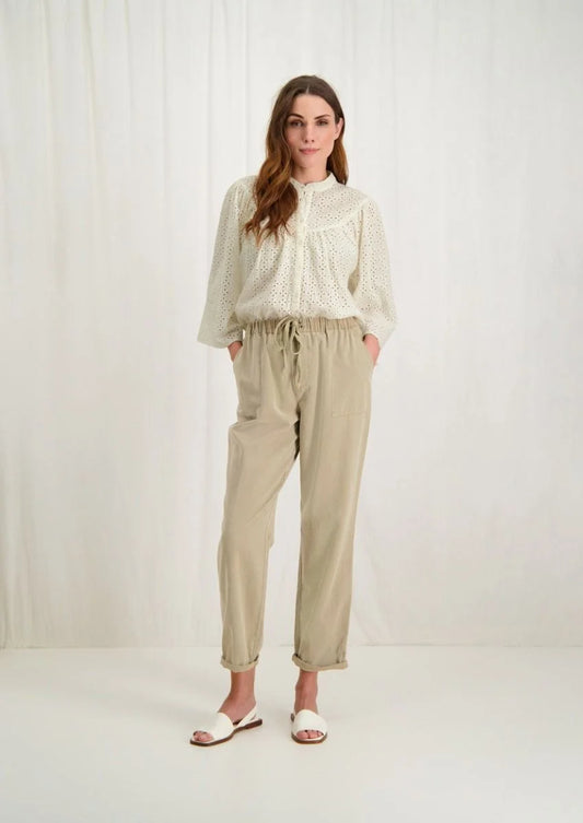 Introducing the Merlin Blouse by Circle of Trust in Antique White. Made from soft 100% cotton eyelet fabric, it's comfy and breathable. With its loose fit and wide 3/4 sleeves, it's effortlessly stylish. Featuring delicate embroidery, a classic crew neck, and a button placket, it's a versatile piece for any occasion. Dress it up or down, it's bound to be one of the prettiest blouses in your wardrobe.