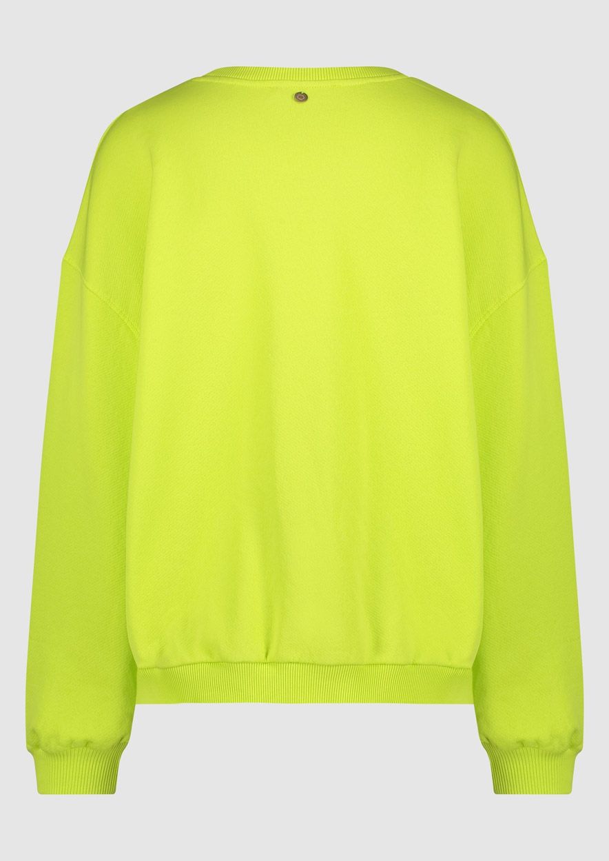 Nikita Sweatshirt by Circle of Trust features a crew neck and rib-knitted cuffs in a vibrant neon green hue. lemon cyprus boutique