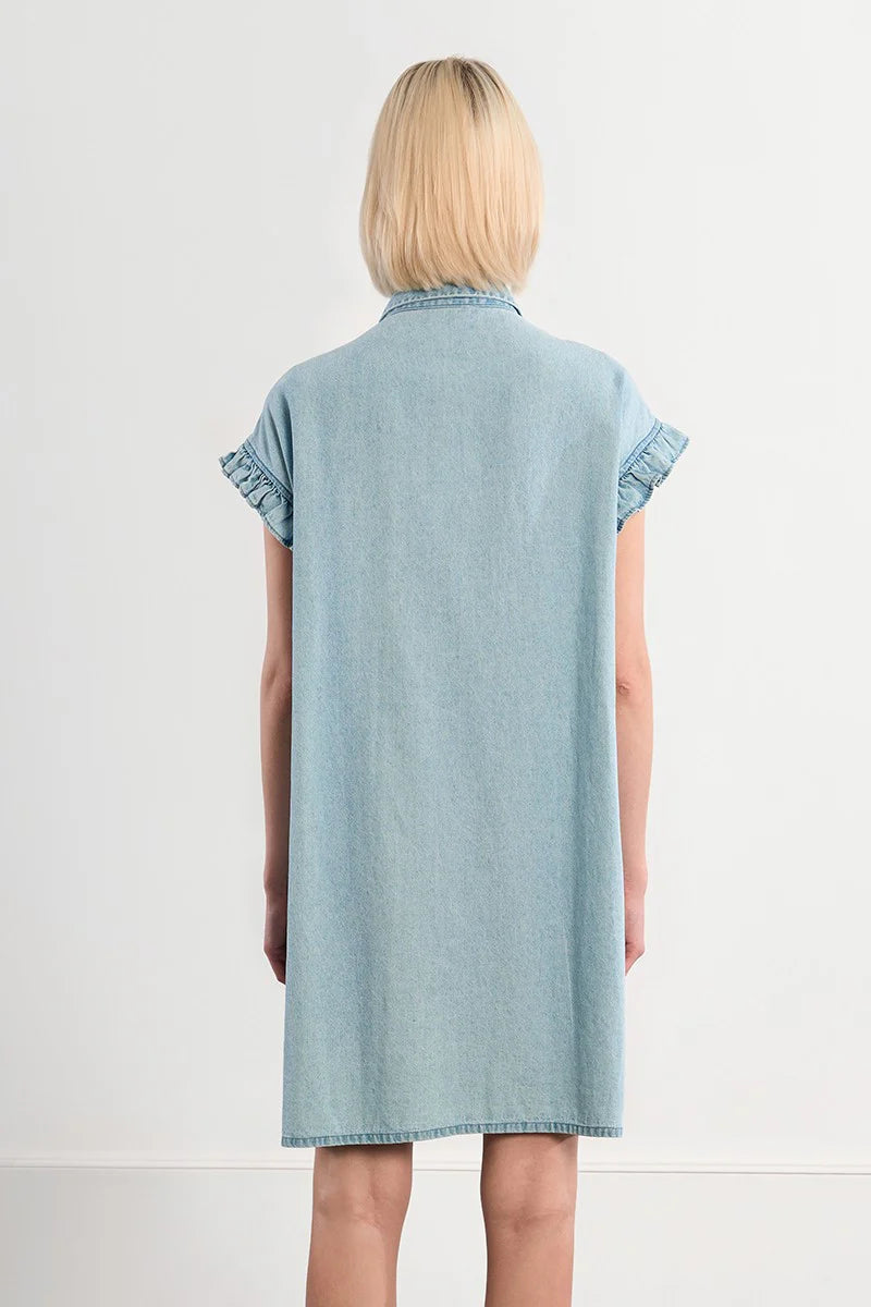 Light blue denim dress worn by a person on a white background