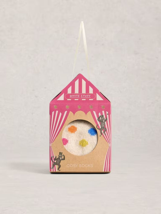 Packaged socks with colorful design on a light gray background