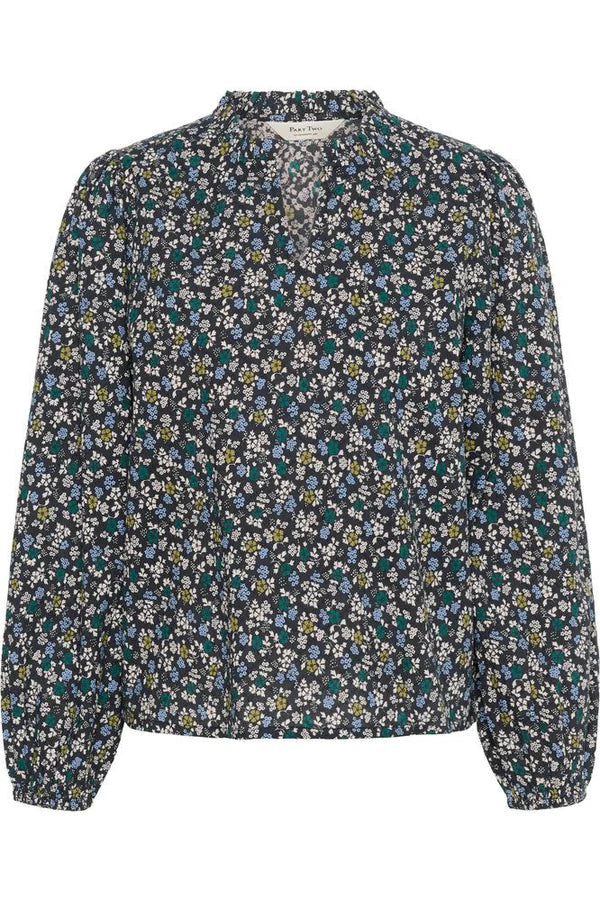 Floral patterned blouse on a white background