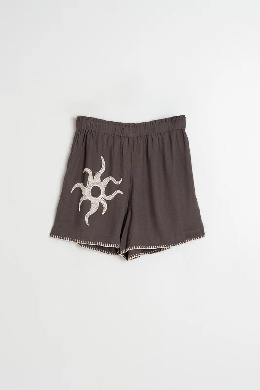 Brown shorts with a white symbol on a white background