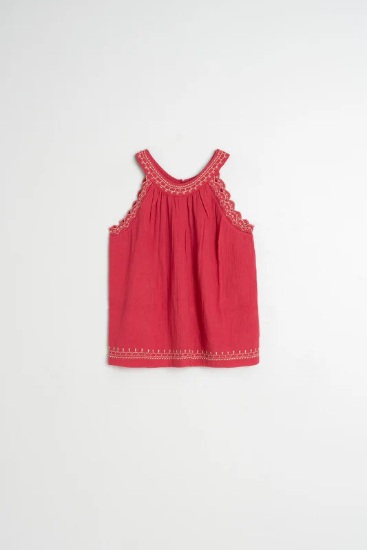 Red dress with lace details on a white background